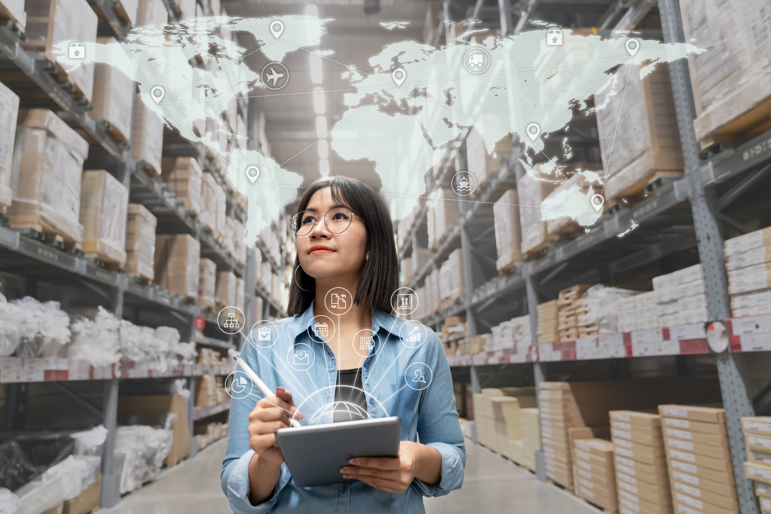 Young woman looking at inventory in a warehouse